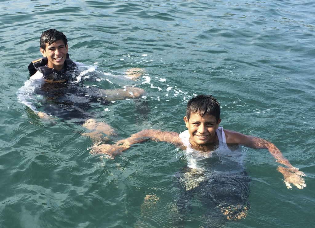 Francisco and Juan Diego swam out to chat with us. We exhausted our Spanish and they remembered how to ask "do you have any candy" in English.